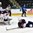 GRAND FORKS, NORTH DAKOTA - APRIL 23: USA's Adam Fox #8 blocks a shot while USA's Joseph Woll #29 looks on during semifinal round action at the 2016 IIHF Ice Hockey U18 World Championship. (Photo by Matt Zambonin/HHOF-IIHF Images)

